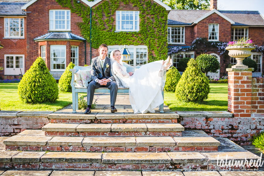 Bride and groom on bench