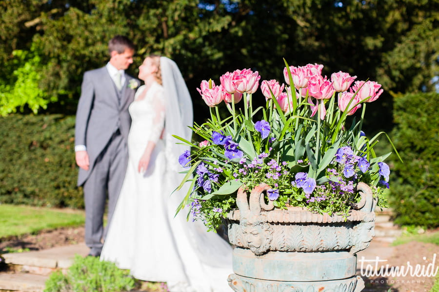 Bride and groom next to flowers