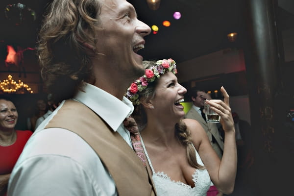 Bride and groom enjoying speech