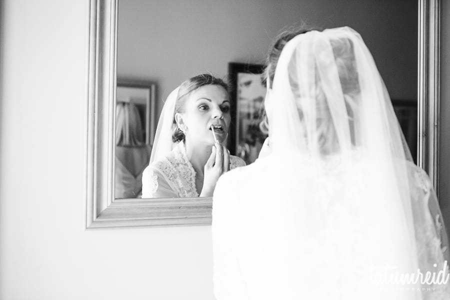 Bride looking in mirror