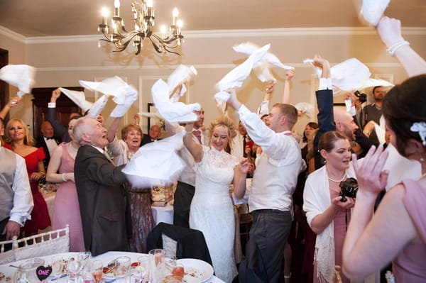 Wedding guests having napkins