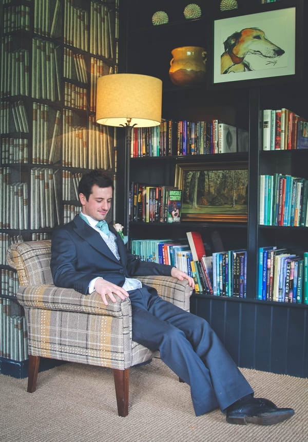 Groom sitting in chair - Picture by Twirly Girl Photography