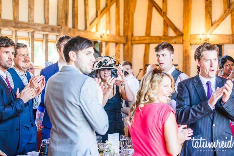 Wedding guests standing clapping