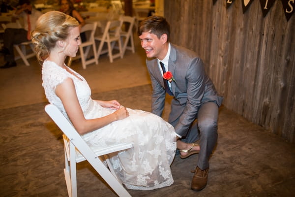 Groom taking of bride's garter