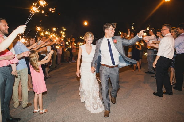 Bride and groom leaving wedding