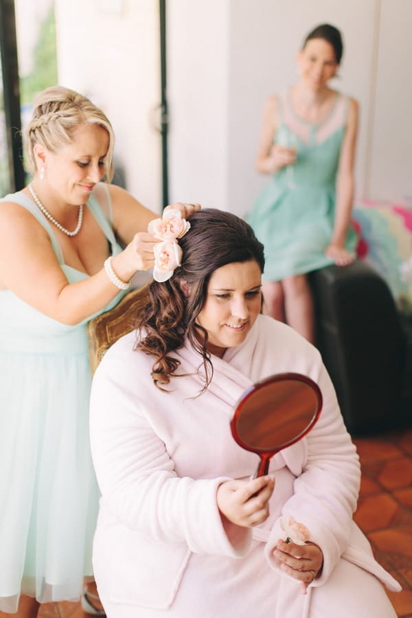 Bride holding mirror