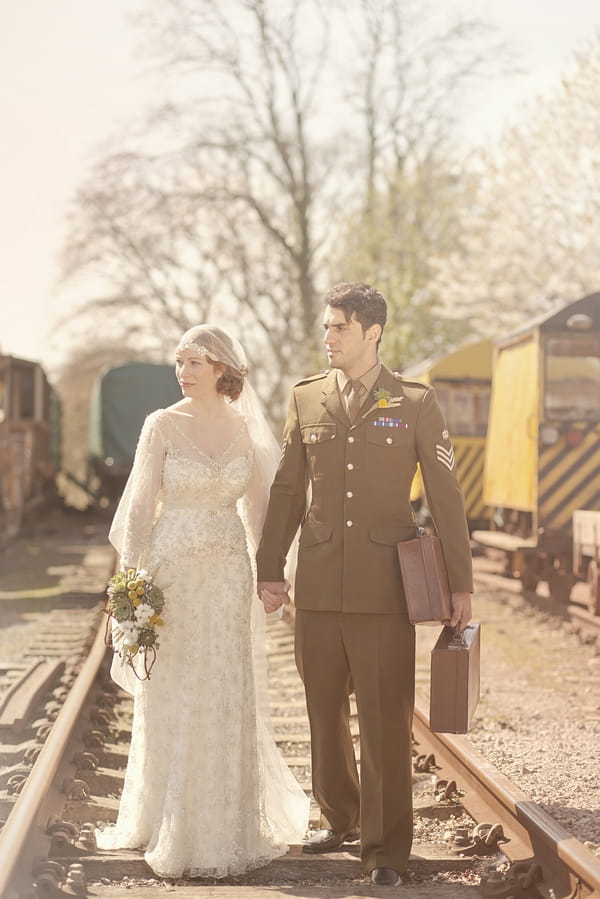 1920's bride and groom holding hands