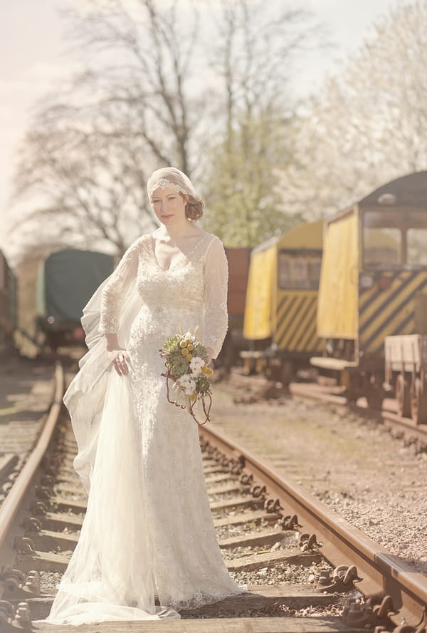 1920's bride standing on train track