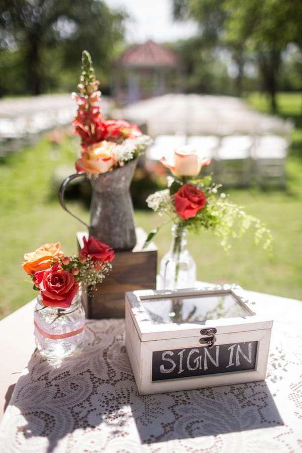 Flowers and sign in box