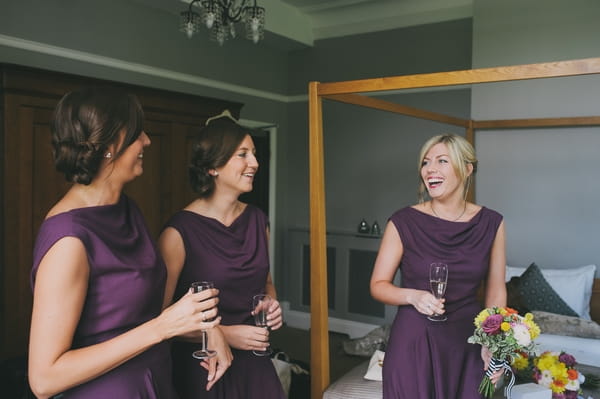 Bridesmaids in purple dresses