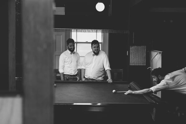 Groomsmen playing snooker