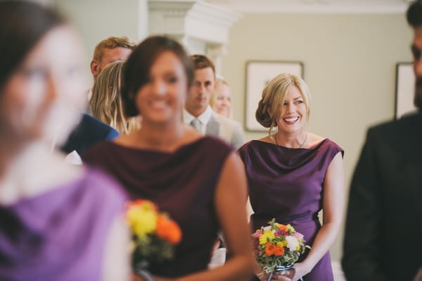 Bridesmaids entering wedding ceremony