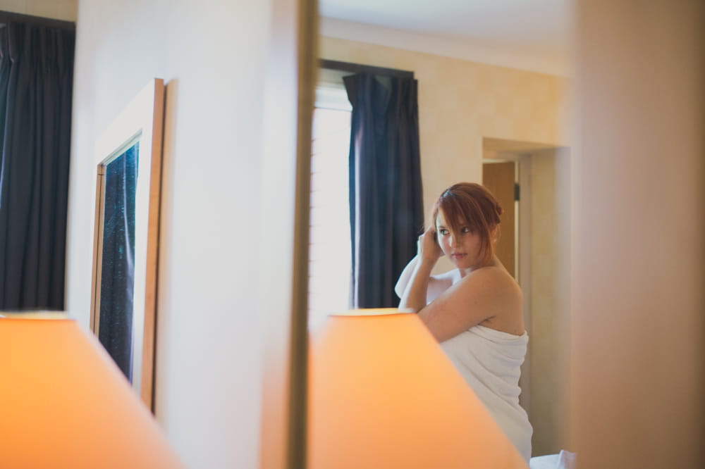 Bride looking in mirror