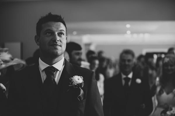 Groom waiting at altar