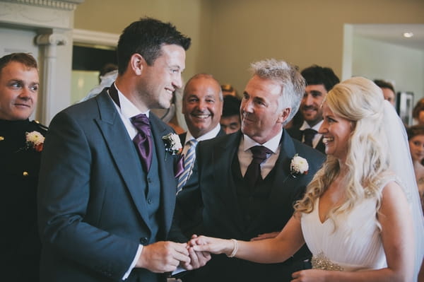 Groom taking bride's hand