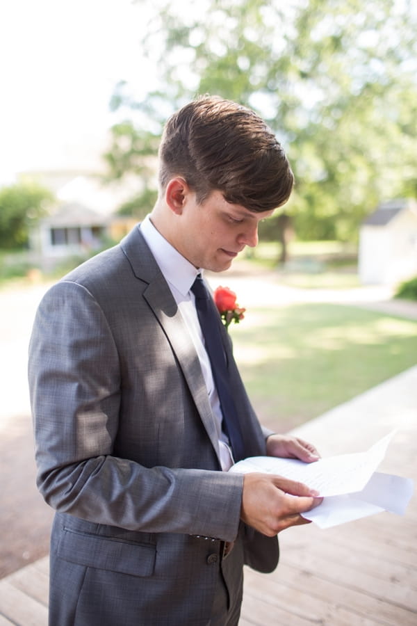 Groom reading letter