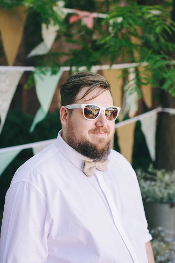 Groom wearing sunglasses