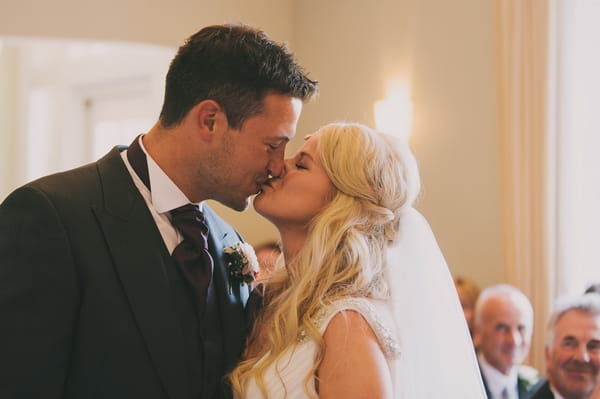 Bride and groom kissing