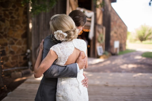 Bride and groom hug