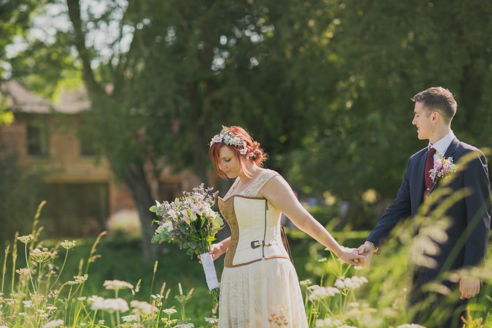 Bride leading groom by the hand