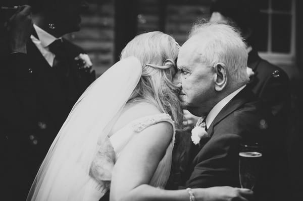 Bride hugging man