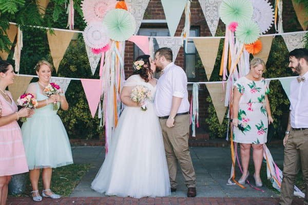 Bride and groom kiss