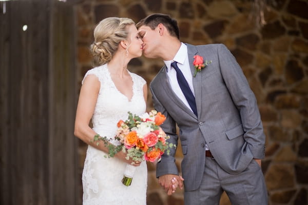 Bride and groom kiss