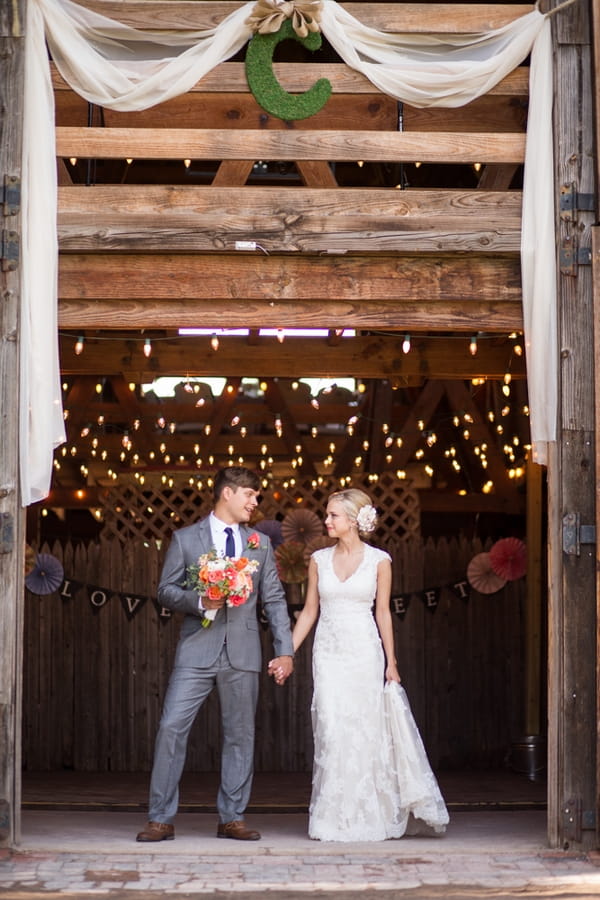 Bride and groom holding hands