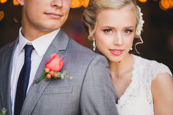 Bride with head by groom's shoulder