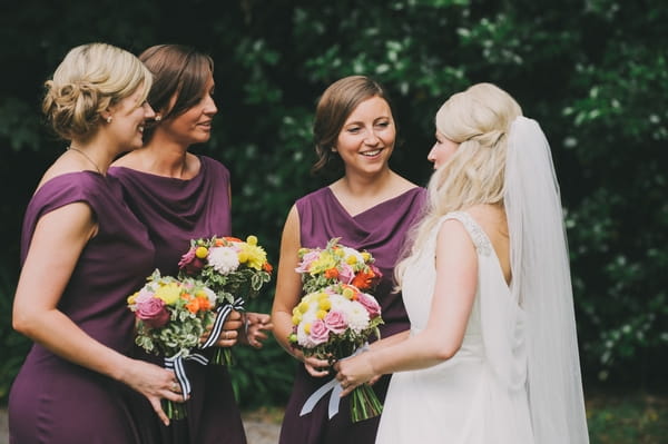 Bride talking to bridesmaids