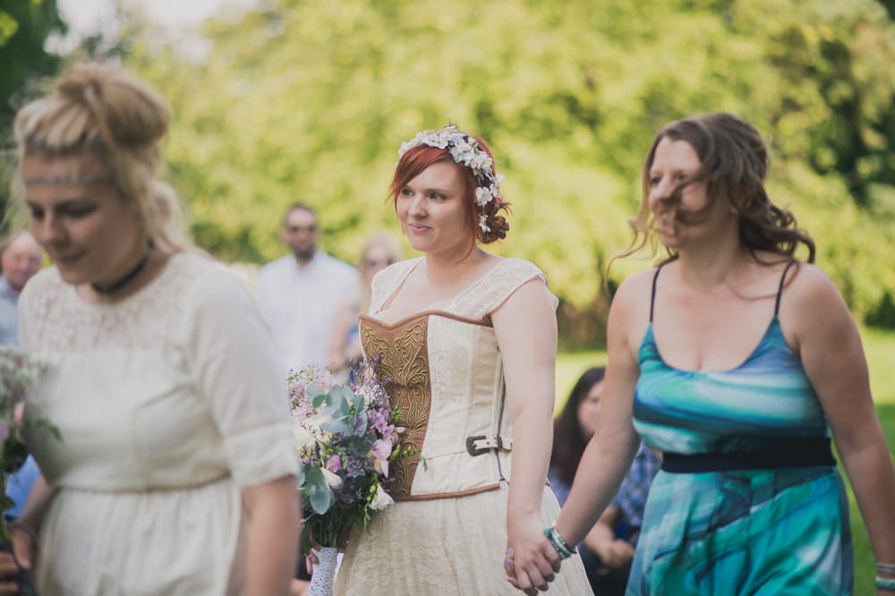 Bride holding lady's hand