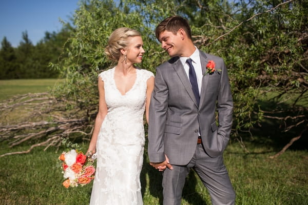 Bride and groom holding hands