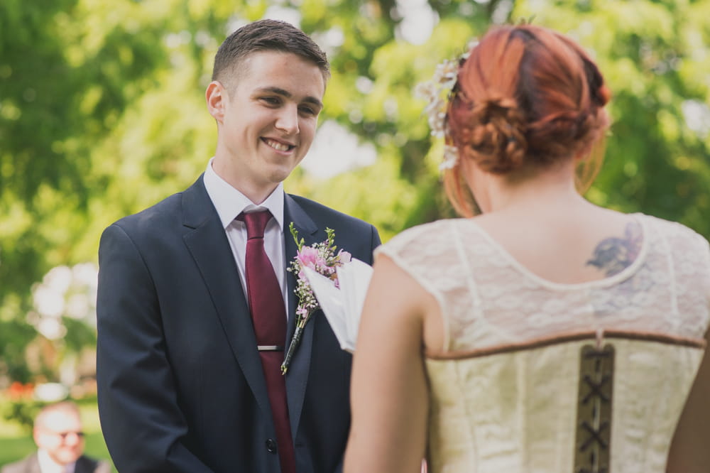 Bride and groom facing each other