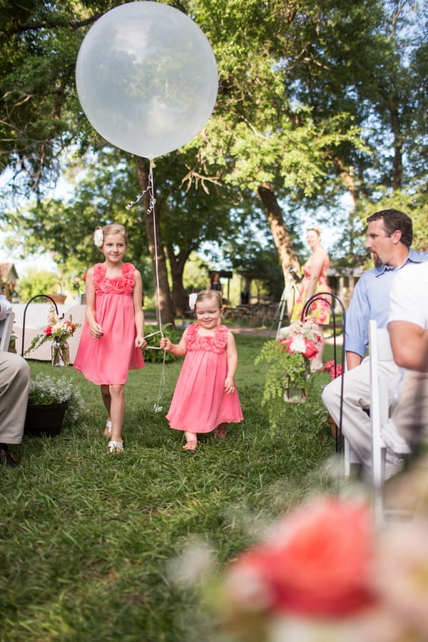 Flower girls walking down aisle