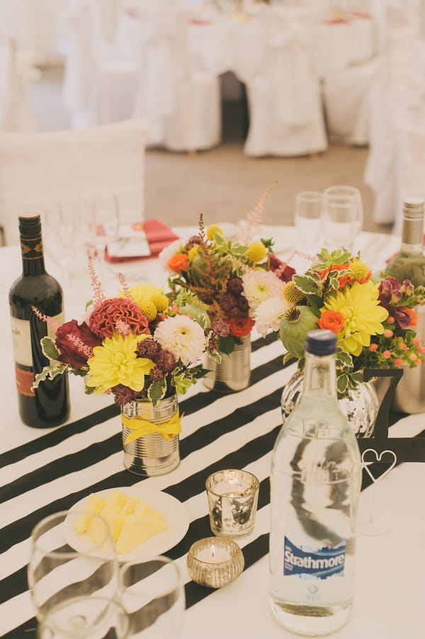 Flowers on black and white striped table cloth