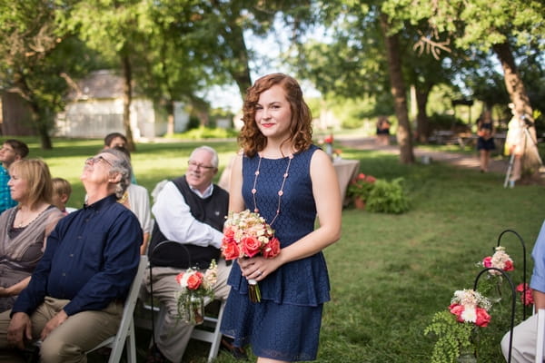 Bridesmaid walking down aisle