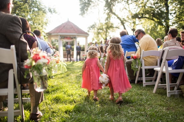 Flower girls walking down aisle