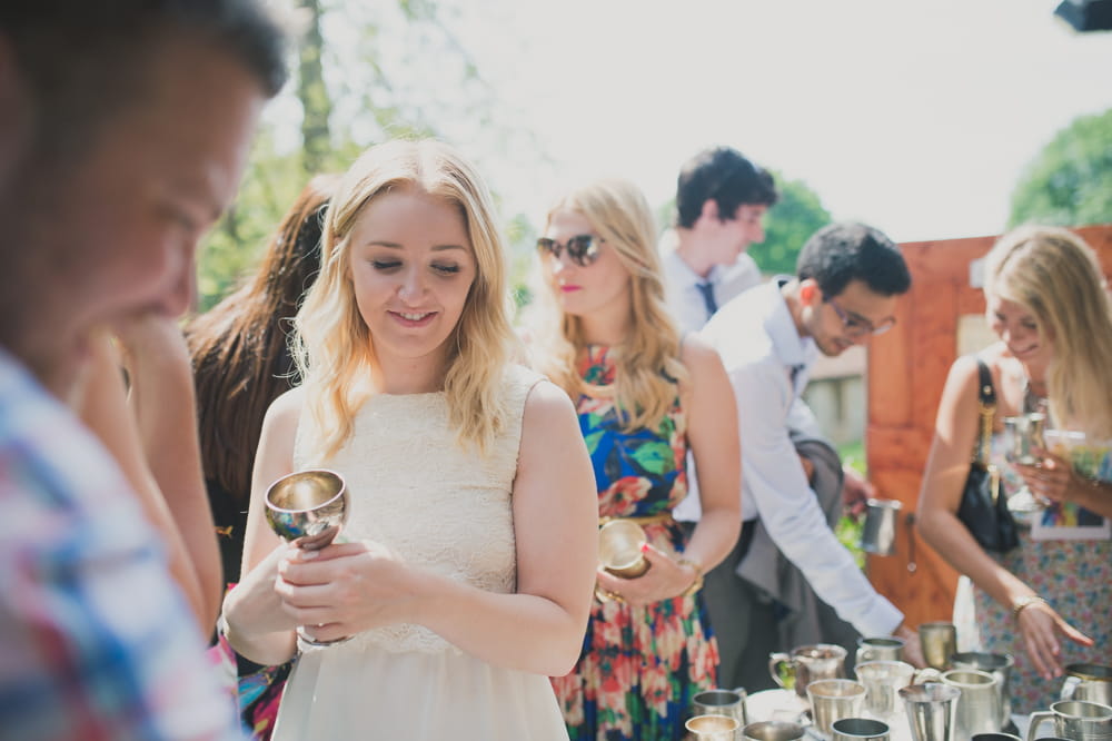 Bridesmaid holding silver goblet