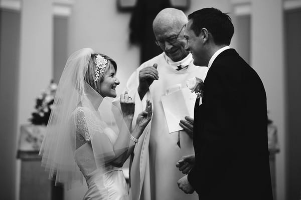 Happy bride at altar - Picture by Martin Makowski Photography