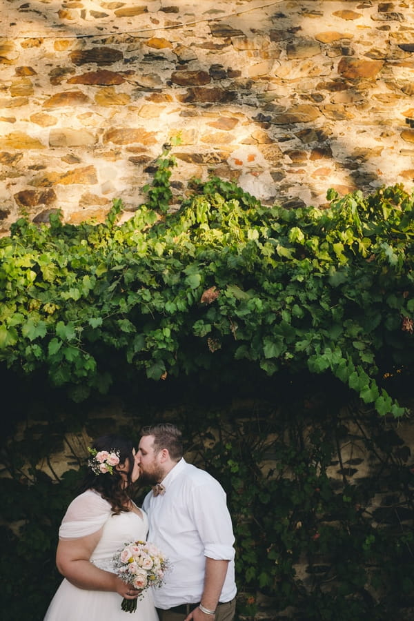 Bride and groom kissing