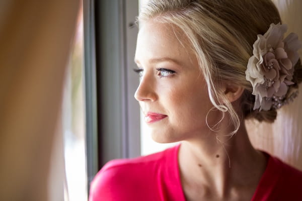 Bride looking out of window