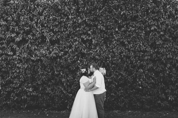 Bride and groom kissing