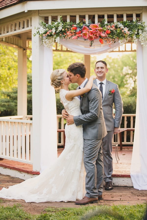 Bride and groom kiss