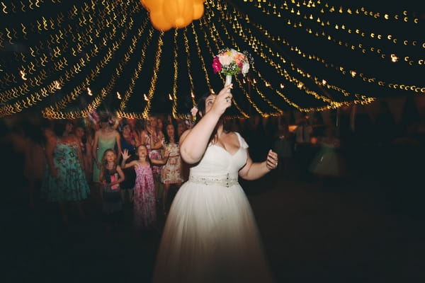 Bride throwing bouquet