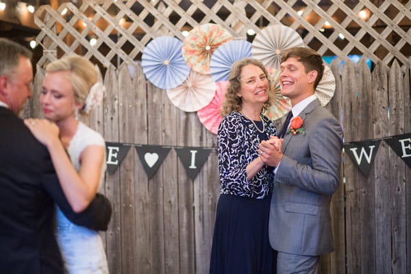 Groom dancing with mother