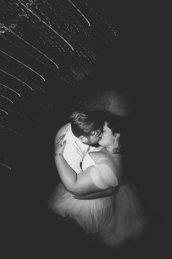 Bride and groom kissing