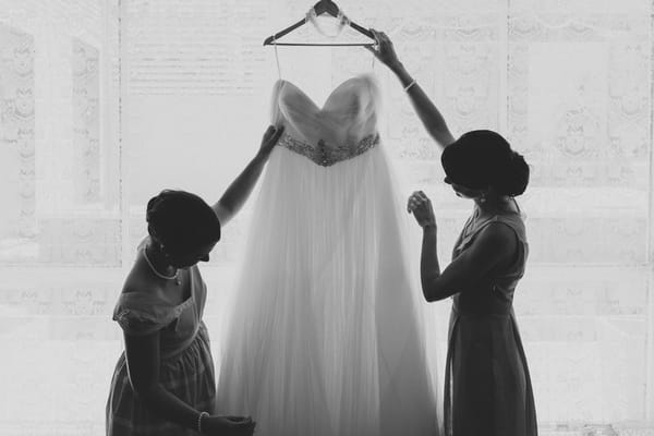 Holding up wedding dress