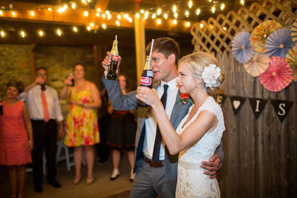 Bride and groom raising toast