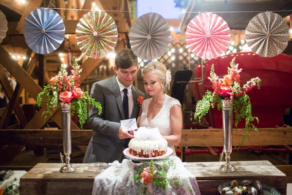 Bride and groom cutting cake