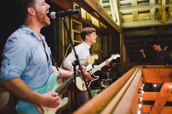 Groom playing guitar